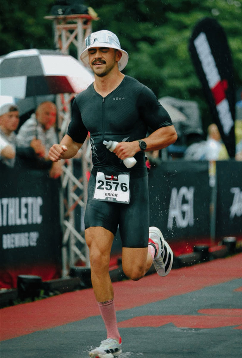 The coach is smiling while running.